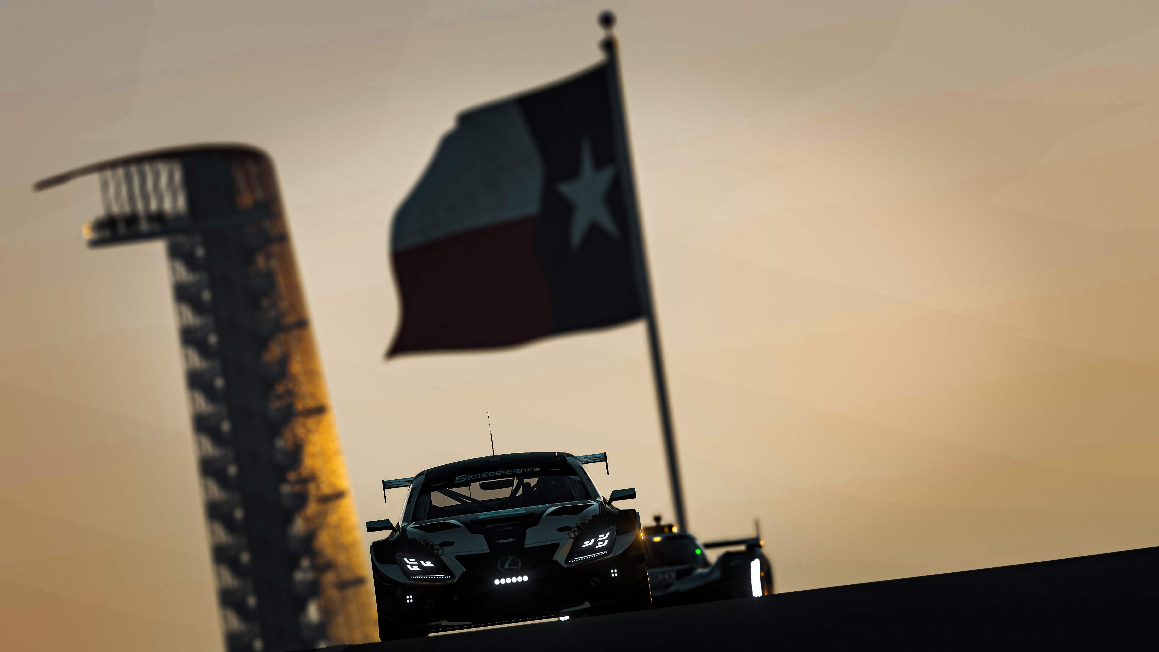 MercSimRacing cars racing beneath the Texas flag